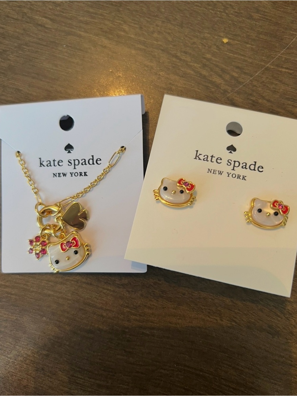 kate spade gold-tone Hello Kitty charm necklace and stud earrings with pink bows